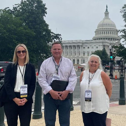 People posing in front of U.S. Capitol in Washington D.C.
